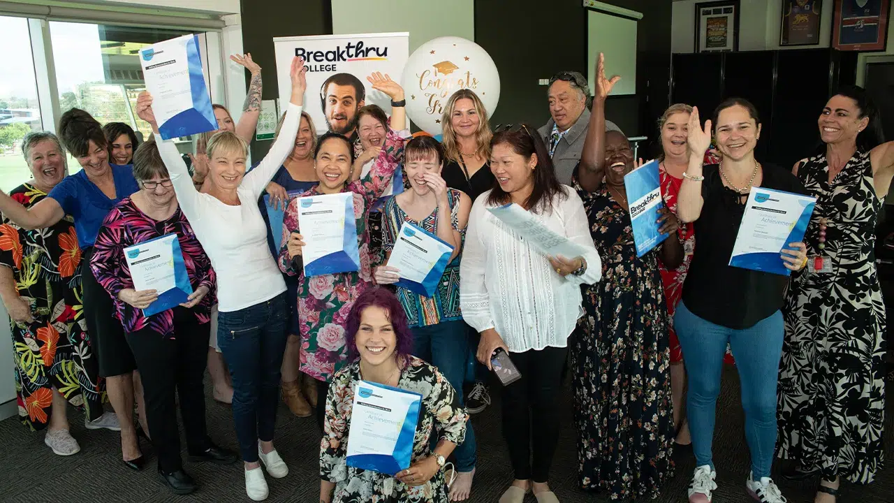 Breakthru students celebrating after graduating with community services qualifications